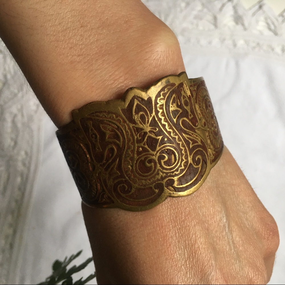 Vintage brass cuff with ornate inlaid detail